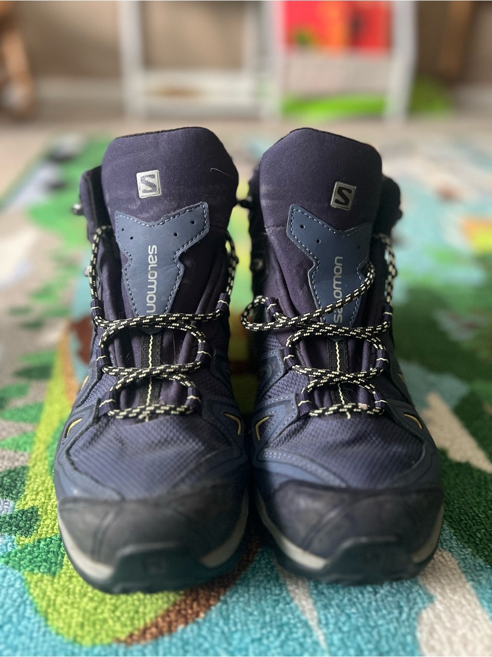 Salomon navy blue hiking boots with yellow trim